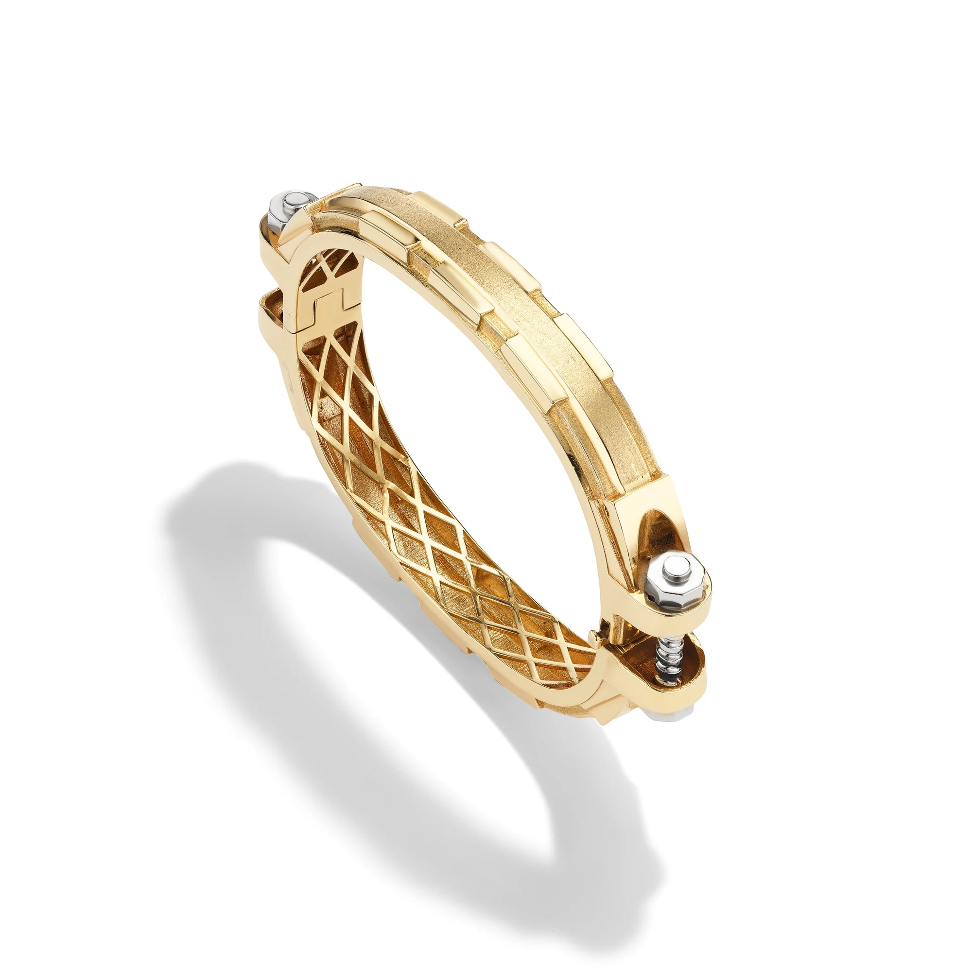 14k yellow gold Coupling bracelet, angled view of solid gold bolt-and-nut links with sculpted lattice interior.   