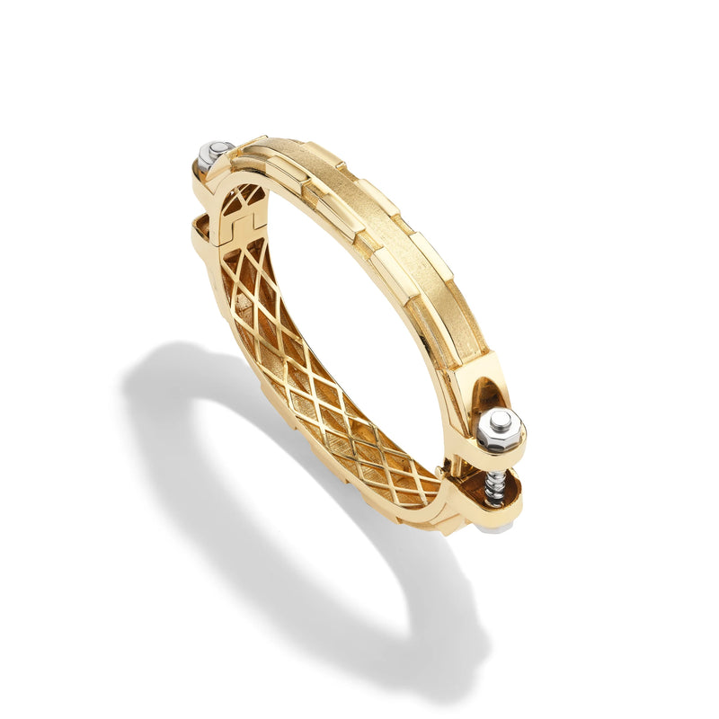 14k yellow gold Coupling bracelet, angled view of solid gold bolt-and-nut links with sculpted lattice interior.   