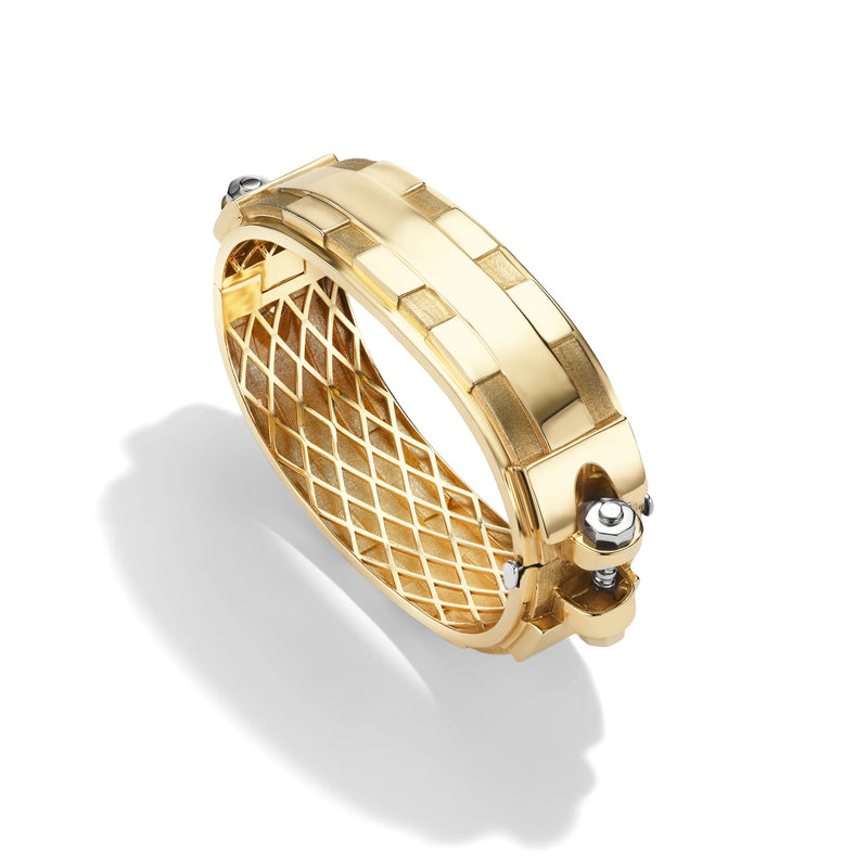 14k yellow gold Large Coupling Cuff, angled view of statement-scale lattice gallery and sculptural gold cuff surface.   